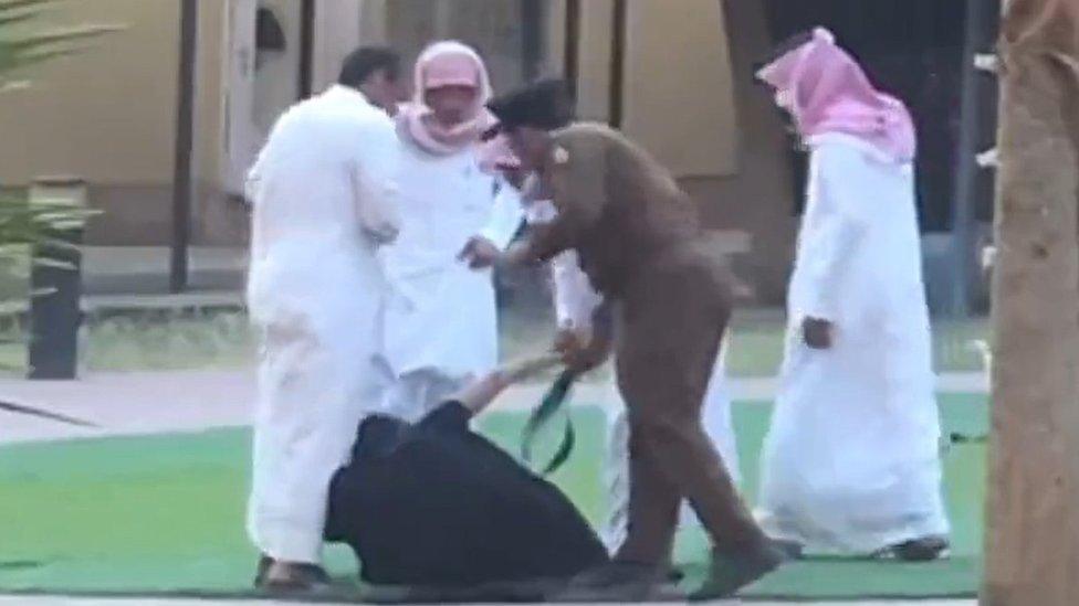 Screengrab of video footage purportedly showing a girl being hit with a belt by a police officer during a raid on an orphanage in Khamis Mushait (30 August 2022)