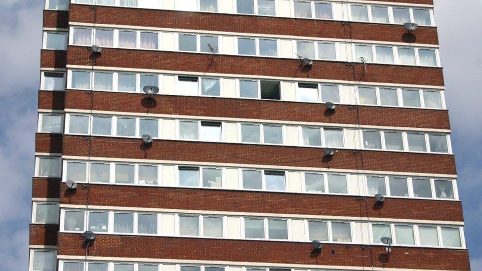 Satellite dishes on the side of a block of flats in Tower Hamlets