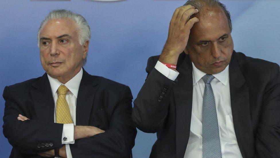 Brazilian President Michel Temer (L) and Rio de Janeiro's Governor Luiz Fernando Pezao, at the Planalto Palace in Brasilia, on February 16, 2018