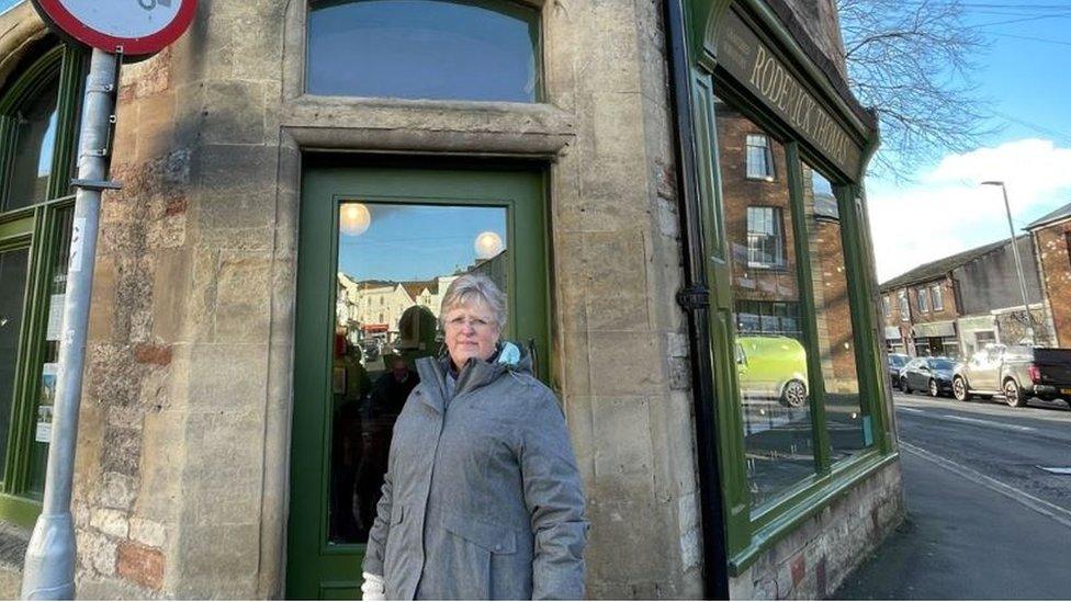 Lady stood in front of old post office building in Wells