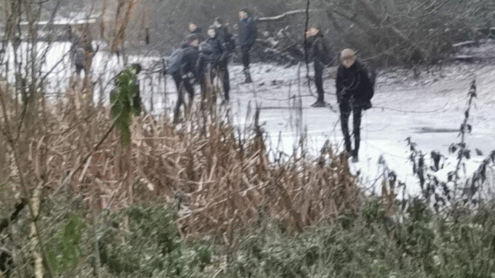 The Darlington pond with people on it