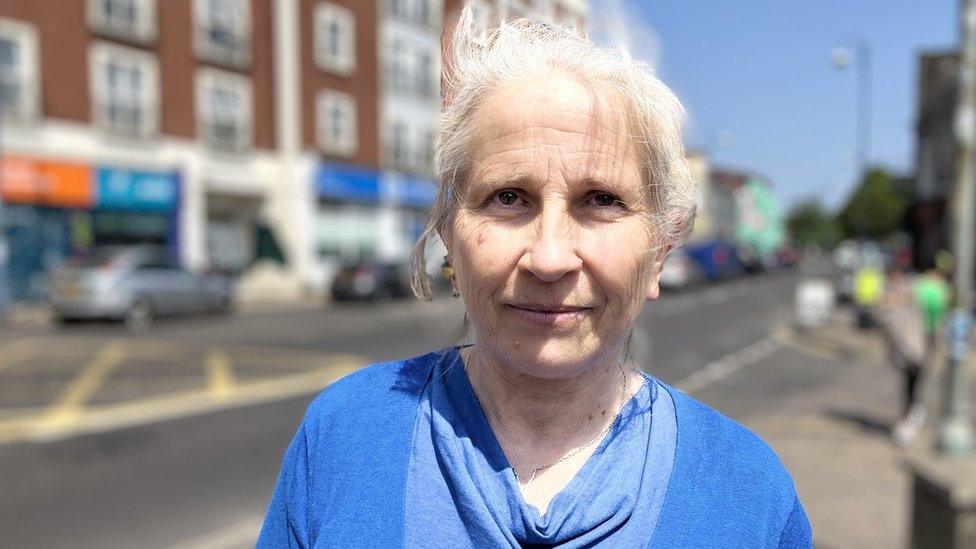 Dentist Gaye Herford looking at the camera wearing a blue top