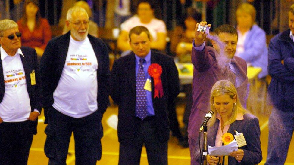 2004 Hartlepool by-election Liberal Democrat candidate Jody Dunn is covered with purple power by Fathers 4 Justice candidate Paul Watson