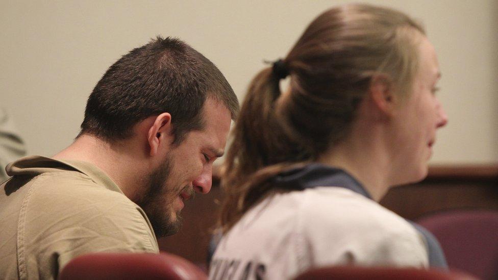 Jose Torres, left, weeps in his seat during sentencing at the Douglas County Courthouse in Douglasville, Georgia, 27 February 2017