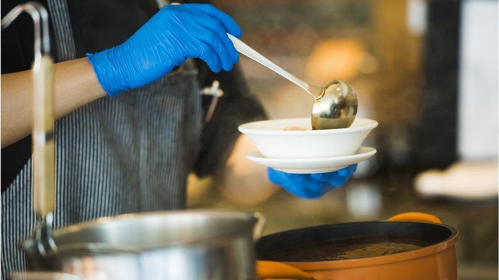 soup being poured into bowl