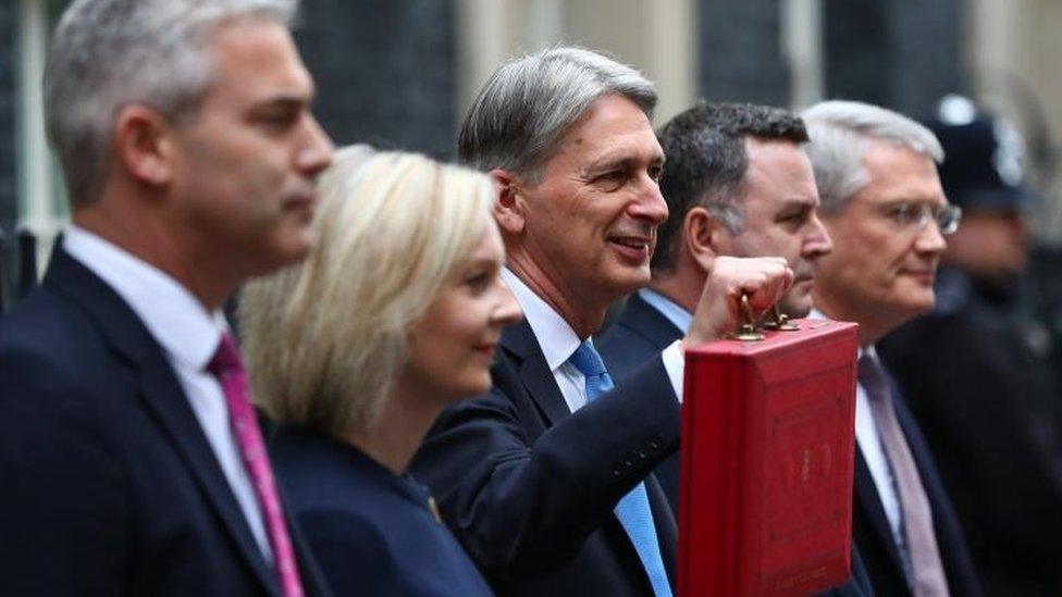 Chancellor Phillip Hammond poses with the budget box at 11 Downing Street