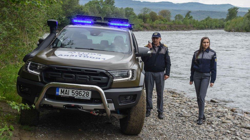 Maria (right), a Romanian border guard officer