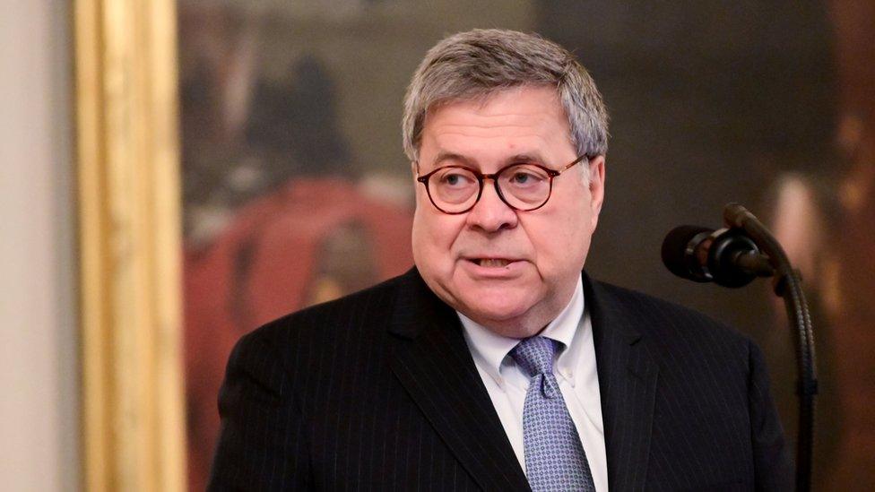 William Barr speaking at a podium