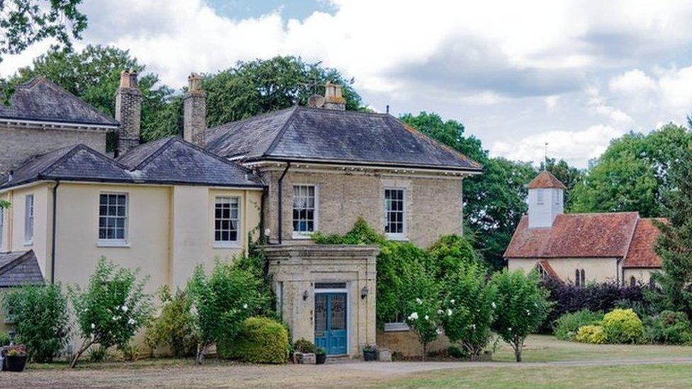 The rectory and church in distance