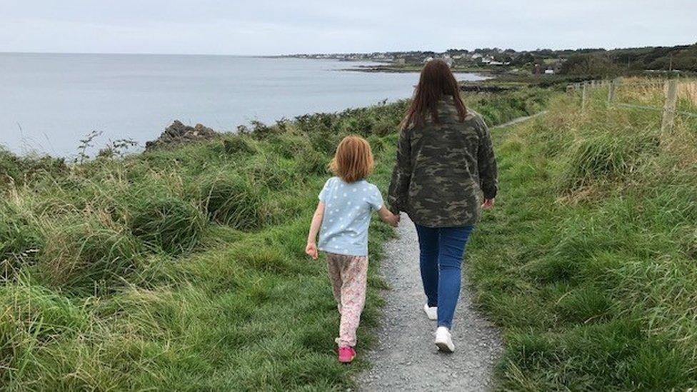 Two people walking along the existing pathway at Orlock between Bangor and Donaghadee