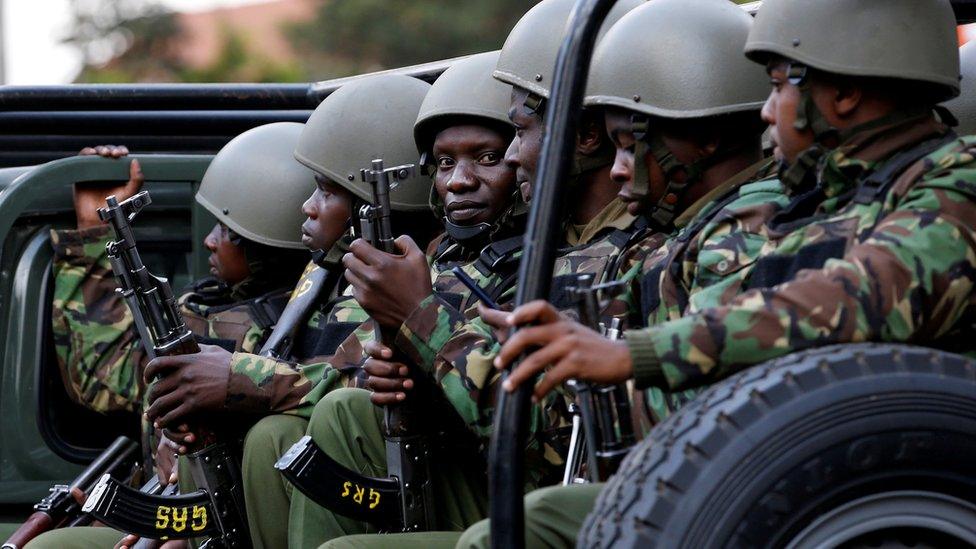 Kenyan police officers drive in their truck (file photo)