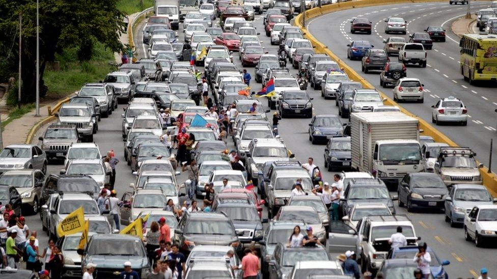 Demonstrators riding motorcycles and driving cars take part in a nationwide protest against President Nicolas Maduro government, in Caracas