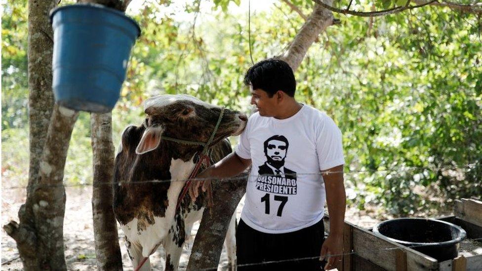 A farmer wears a Bolsonaro T-shirt