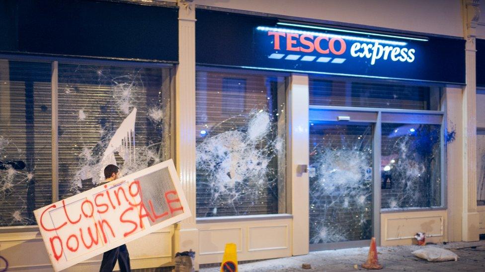 Tesco Express in Stokes Croft, Bristol, with windows smashed in 2011