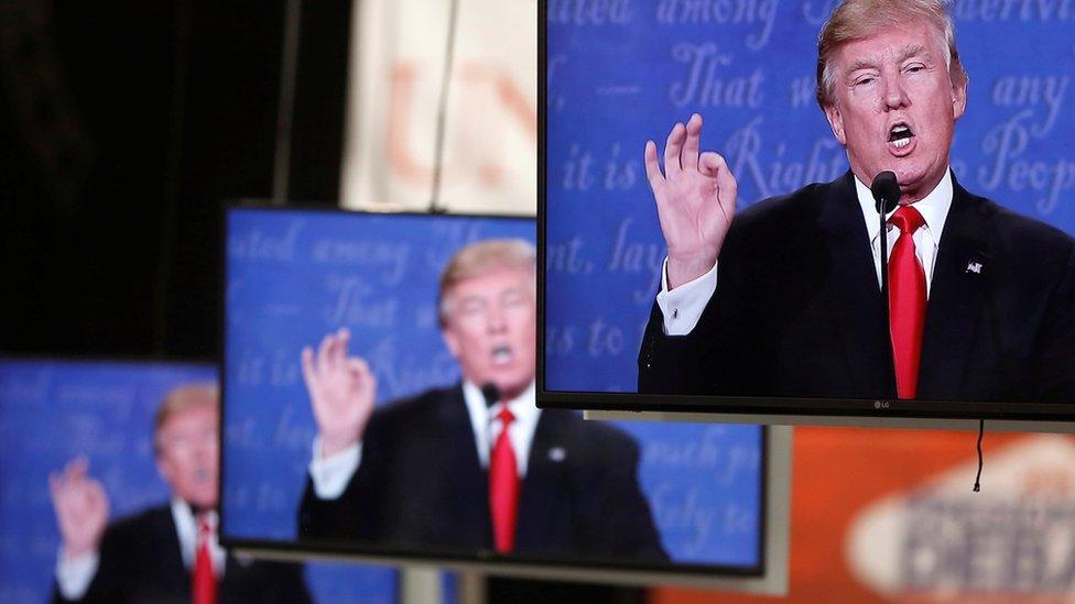 Republican U.S. presidential nominee Donald Trump is shown on TV monitors in the media filing room on the campus of University of Nevada, Las Vegas, during the last 2016 U.S. presidential debate in Las Vegas, U.S., October 19, 2016