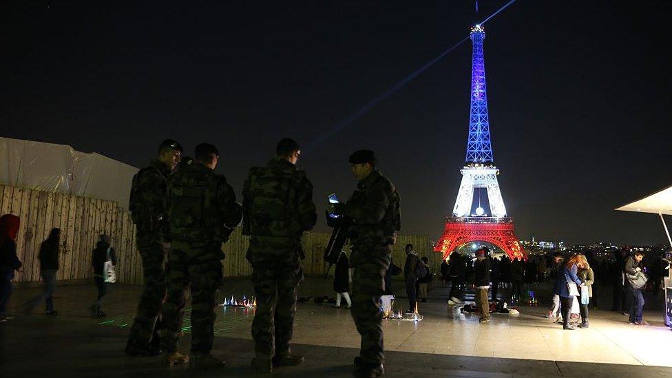 Eiffel tower lit up in red, white and blue