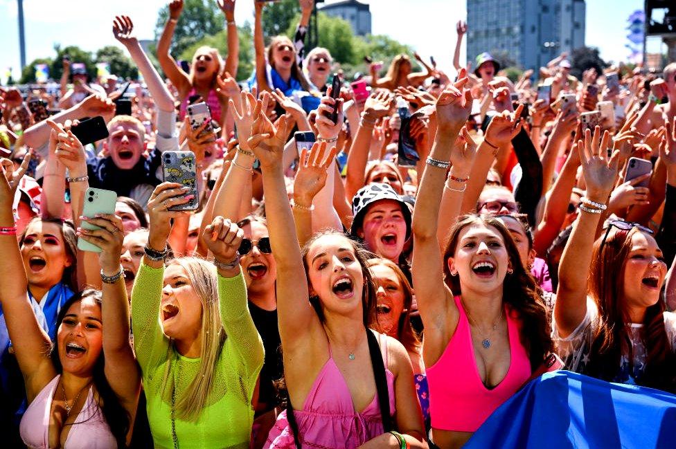 Fans enjoy the sun