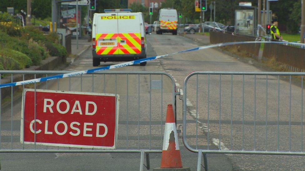 Road closed sign at scene