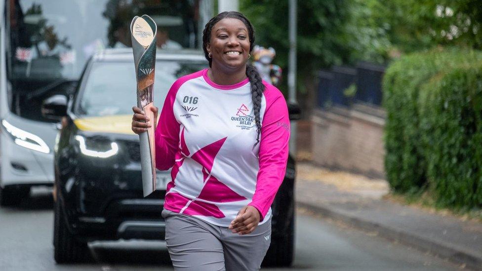 Gabriella Drysdale-Reid carrying the baton