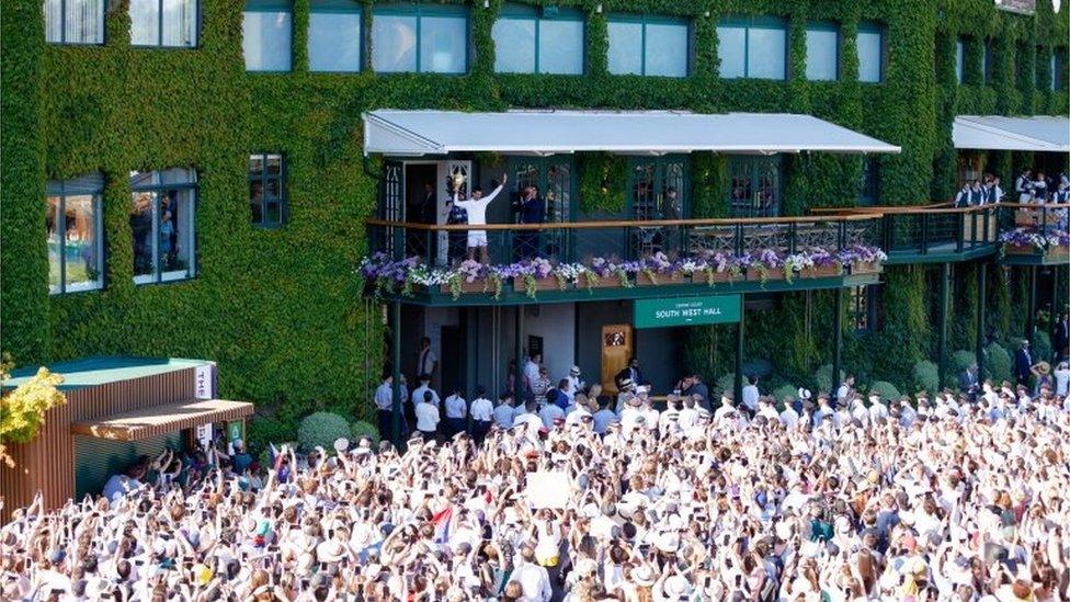 Novak Djokovic celebrates with the Trophy following his victory over Nick Kyrgios in The Final of the Gentlemen"s Singles on day fourteen of the 2022 Wimbledon Championships