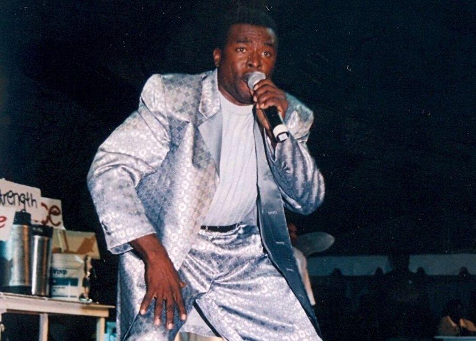 Trevor 'King Zacari' King wearing a silver suit