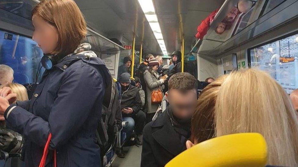 Busy train service where the two metre social distancing rule was unable to be observed by travellers