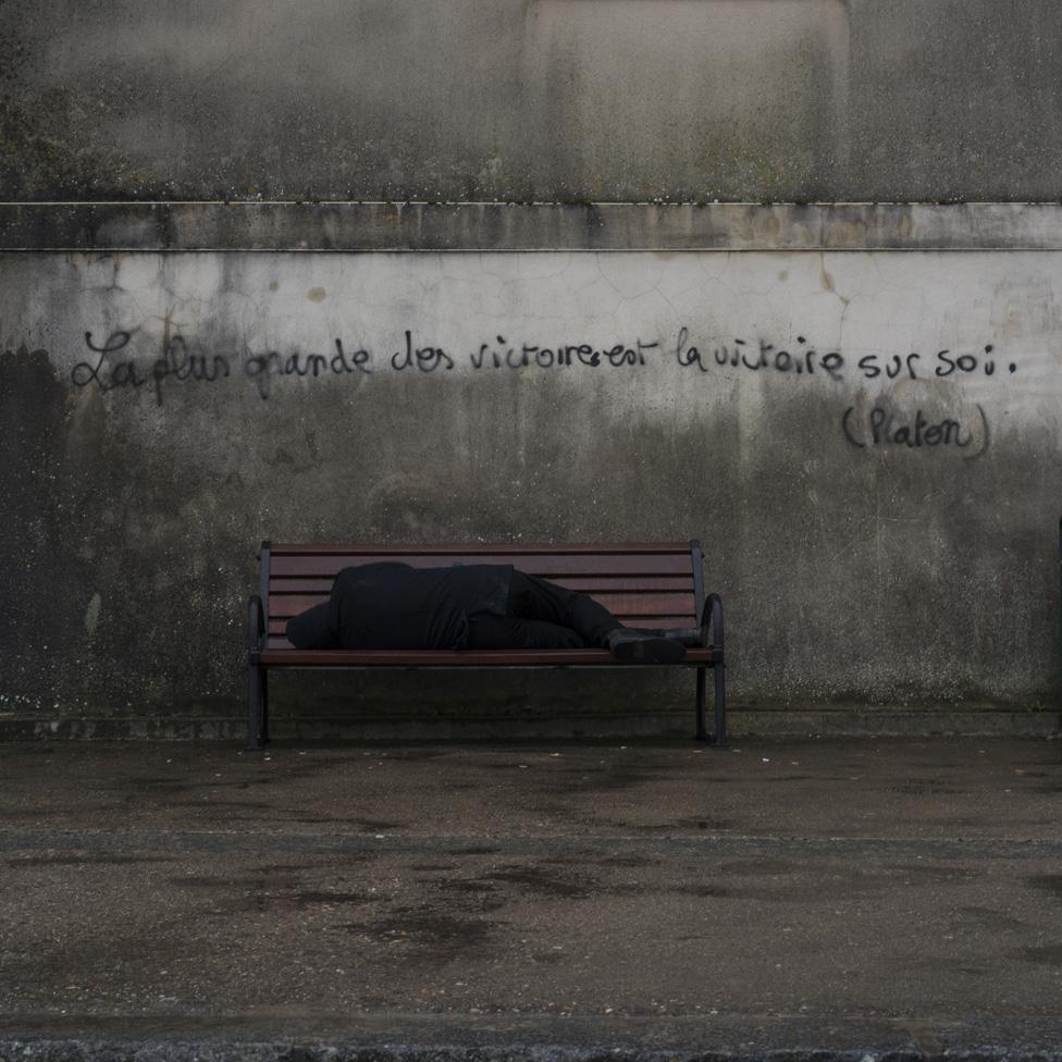 Man sleeping on a bench