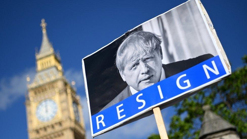 Boris Johnson on placard held by protestor