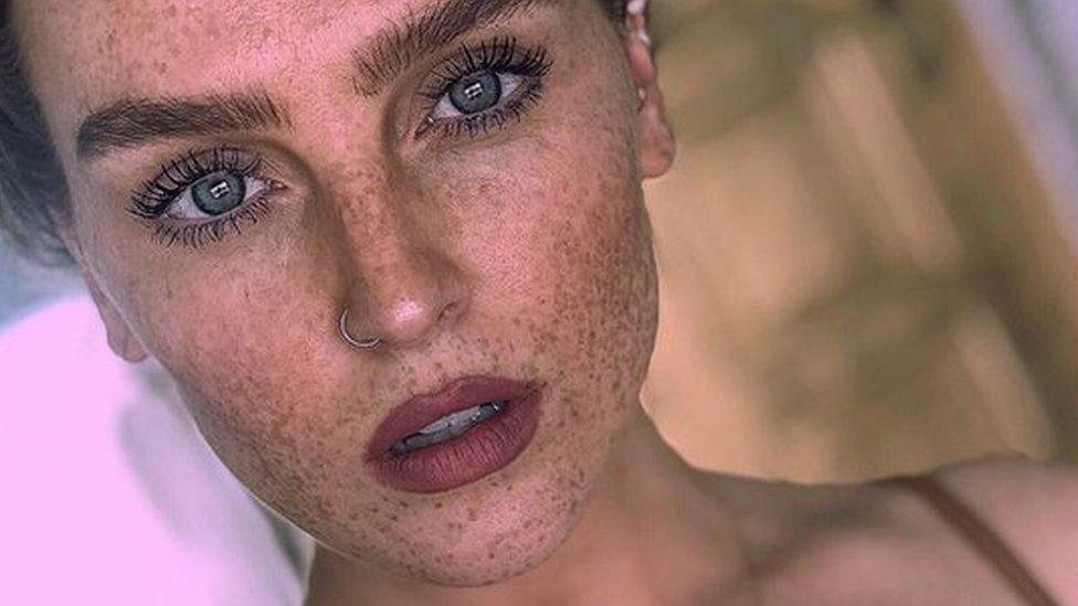 Close-up of Perrie showing the freckles on her face.