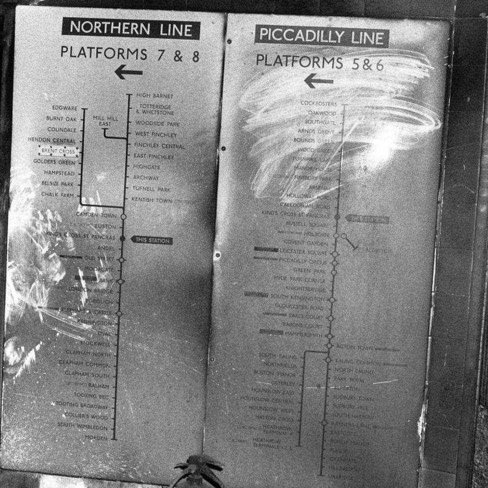 Maps showing tube lines covered with soot at King's Cross underground station