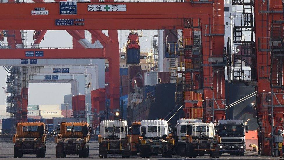 Container is loaded onto ship in Tokyo