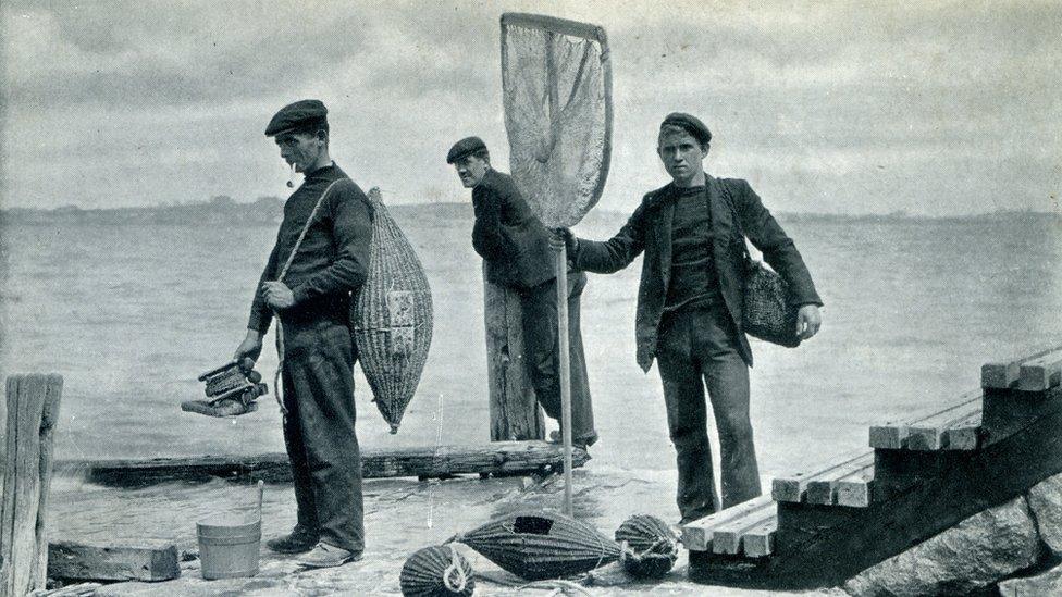 Vintage postcard Guernsey men fishing