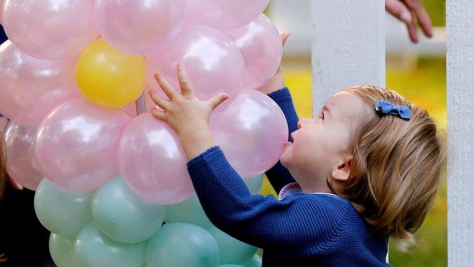 Princess Charlotte grabbing balloons