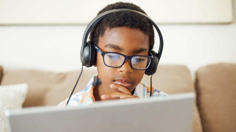 boy-wearing-headphones-on-laptop.