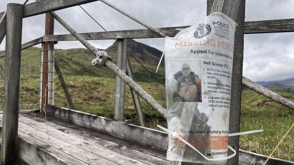 Neil Skinner missing person poster attached to bridge