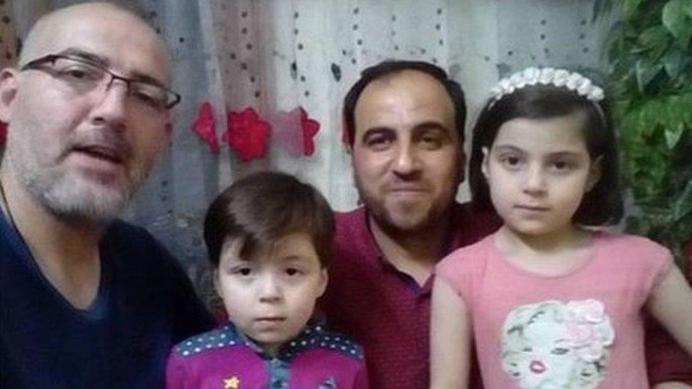 Photo of journalist Khaled Iskef with Omran Daqneesh (2nd left), his father and sister (5 June 2017)