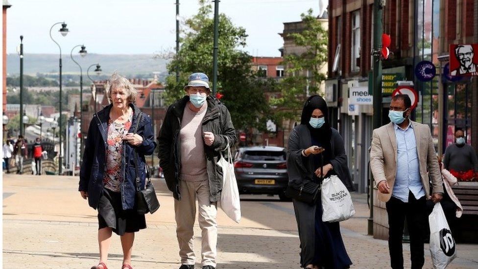 People shopping in Oldham