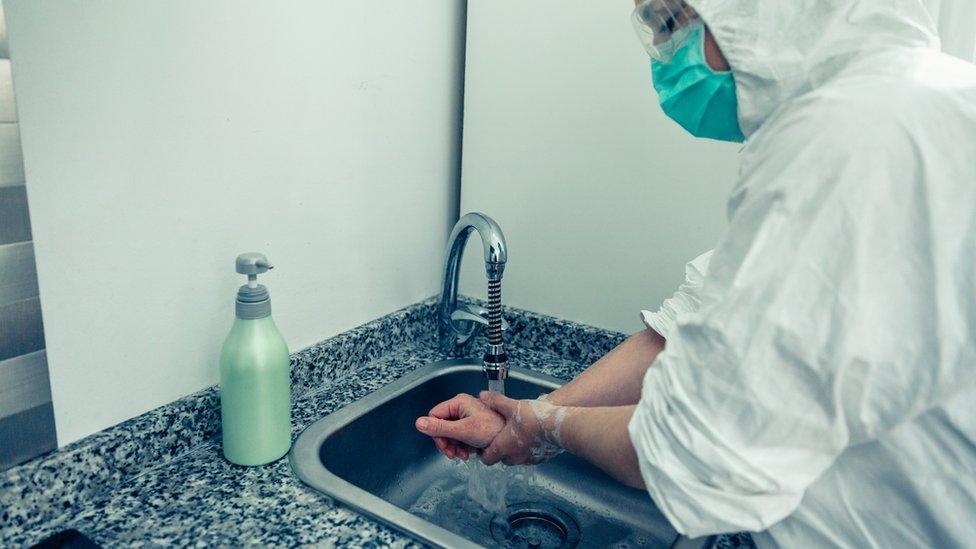 woman washes hands