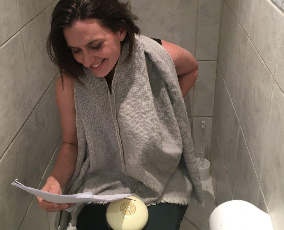 Katy Watson prepares a script in the loo