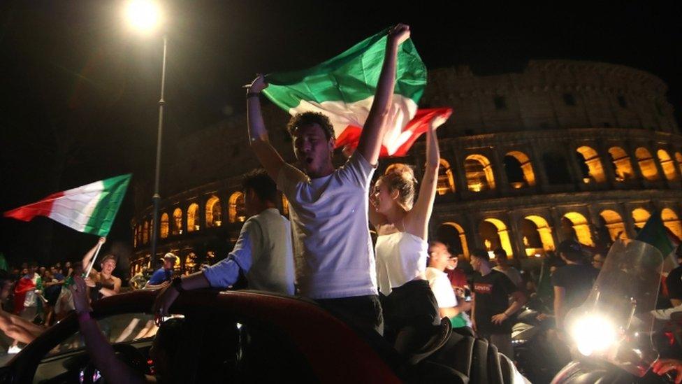 Italian fans outside Rome's Colosseum