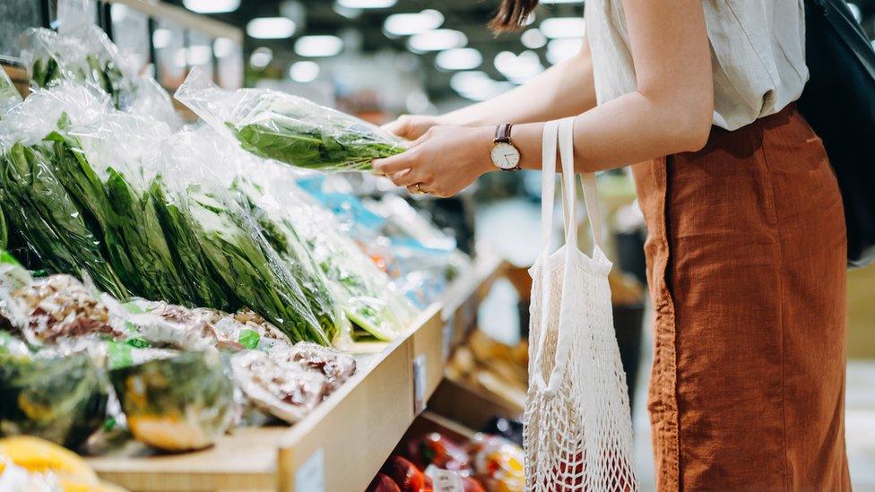 Woman shopping for fruit and vegetables