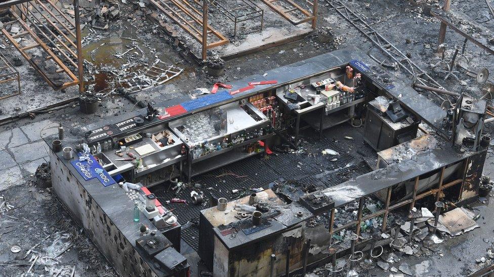 A burned bar counter is seen among the charred remains of a restaurant where a fire broke out on 29 December 2017 in the Indian city of Mumbai