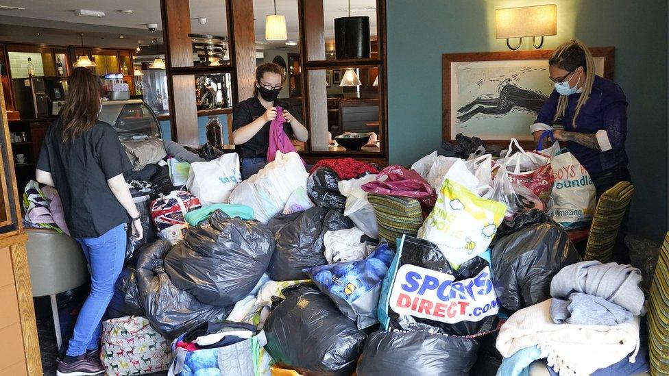 Helpers are sorting through donations at the Hurley Flyer pub