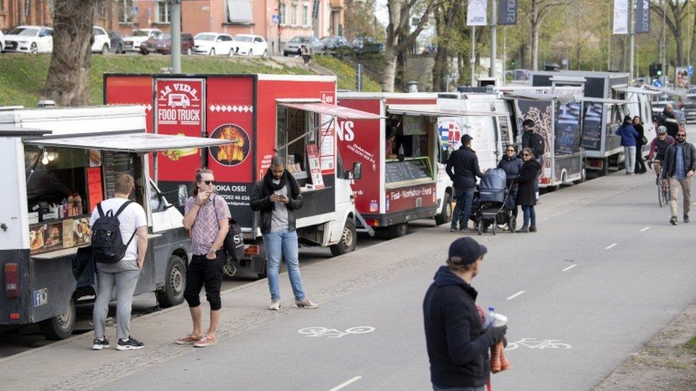 People buying from food trucks in Stockholm, April 2020