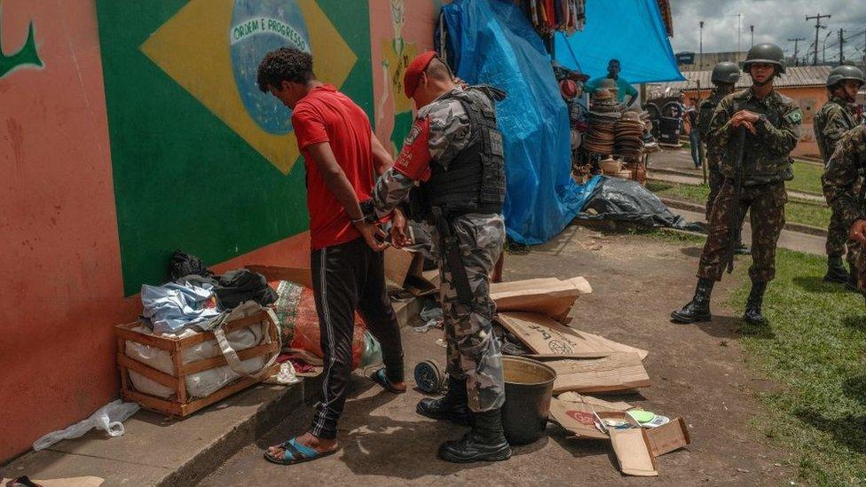 A man being arrested in Brazil