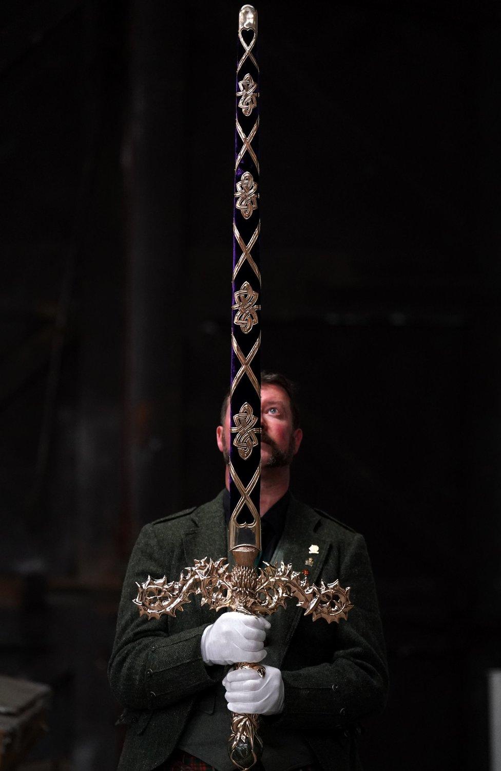 Sword maker Paul Macdonald holds the £22,000 Elizabeth Sword