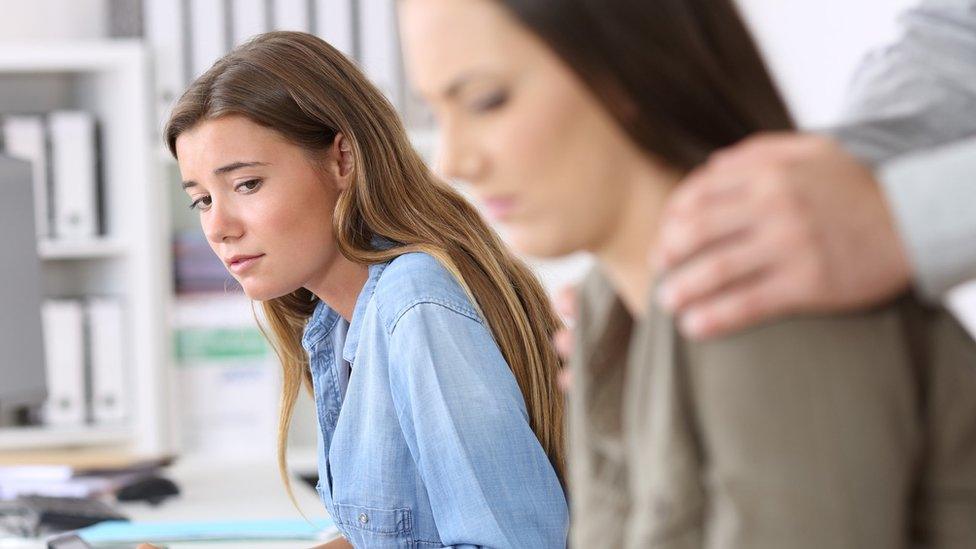 Woman employee being victim of harassment