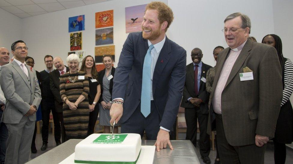 Prince Harry cuts a cake to celebrate the hospitals 150th year next year