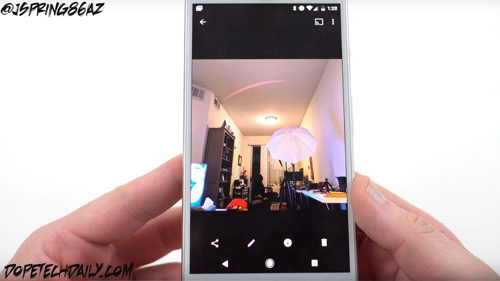 YouTuber Jeff Springer shows off his smartphone