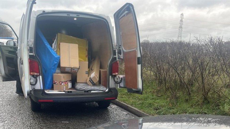 A van filled with parcels